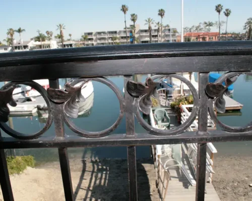https://www.coastironworks.com/wp-content/uploads/2022/03/1-custom-exterior-hand-railings-exterior-railing-stair-railing-wrought-iron-exterior-hand-railing-outside-hand-railing-1-500x400.webp
