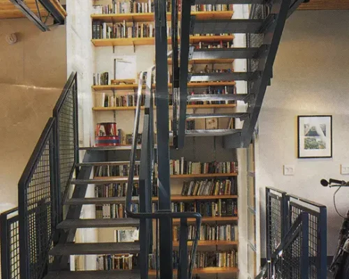 https://www.coastironworks.com/wp-content/uploads/2022/03/1-custom-steel-staircase-wrought-iron-stairs-custom-curved-stair-custom-curved-steel-stairs-modern-steel-stairs-1-500x400.webp